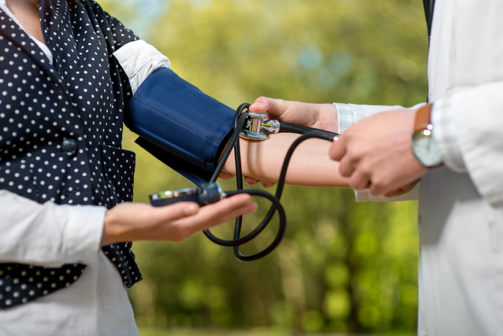 Nurse taking a women's blood pressure